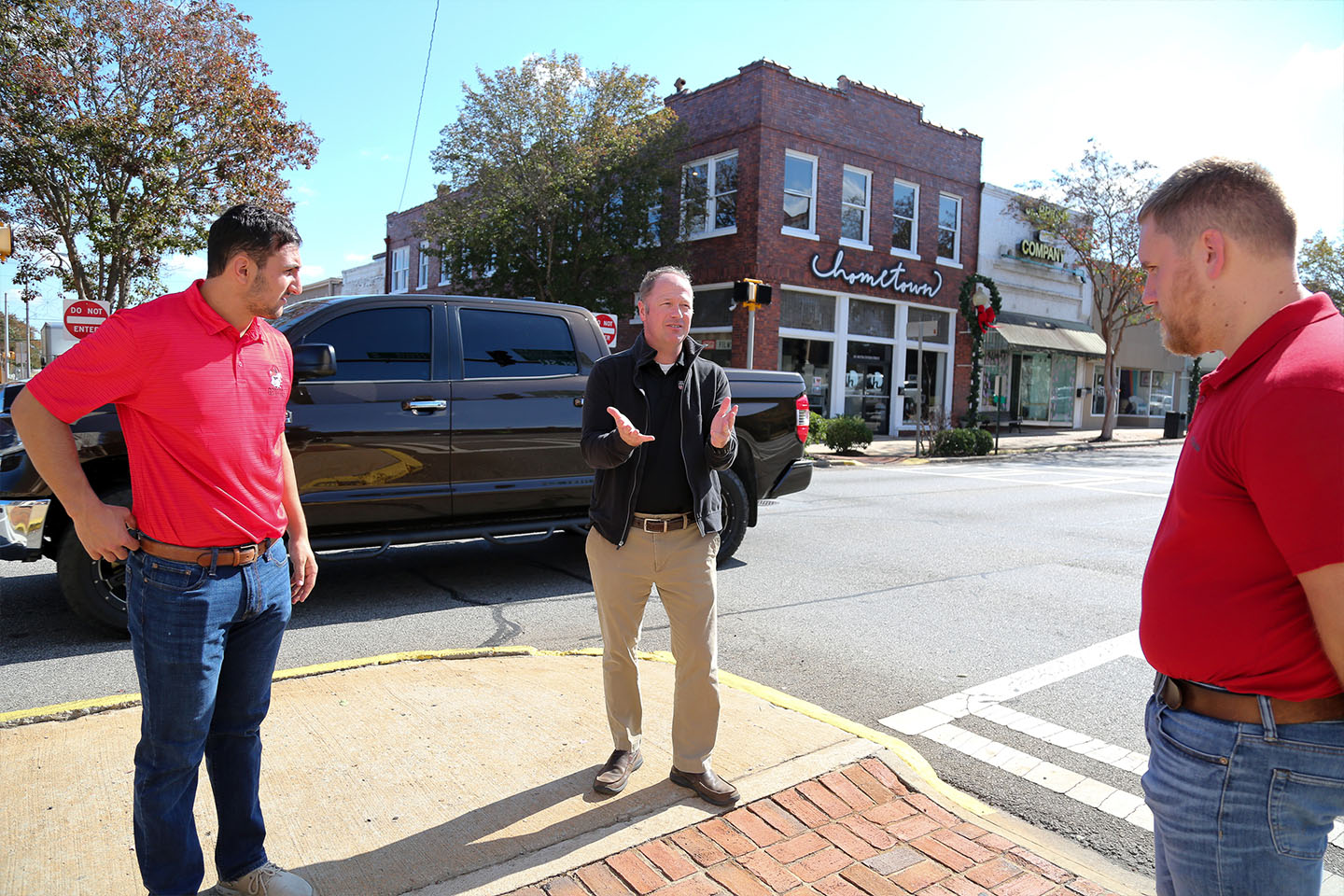 The group discusses downtown traffic issues as they tour the area. Pictured: UGA engineering student Arthur Taran, UGA engineering professor Stephan Durham and Thomaston Economic Development Coordinator Taylor Smith. (Photo by: Shannah Montgomery)