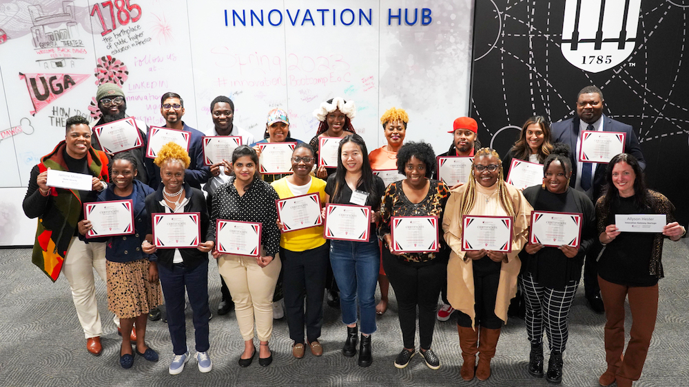 The graduates of Innovation Bootcamp cohort 7 “Entrepreneurs of Color” show off their certificates.