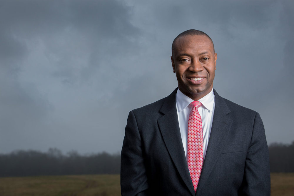 Dr. Marshall Shepherd, photos taken in a field on South MIlledge. Some taken with umbrellas.