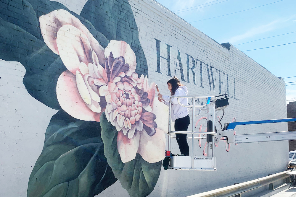 UGA student group Color the World Bright finishing up a mural in downtown Hartwell. (Submitted photo)