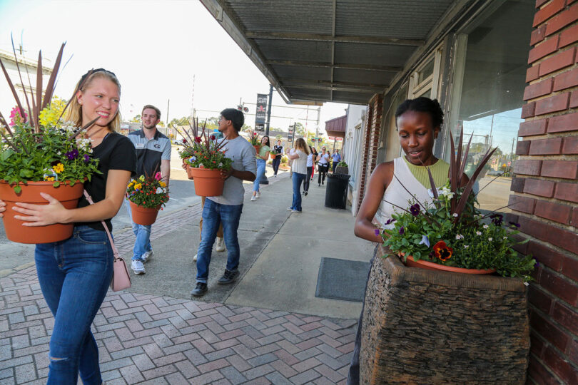 UGA students in the PROPEL Rural Student Scholars Program visit Baxley, Georgia, to learn about rural economic issues and help with a service project to beautify the downtown. (Shannah Montgomery)