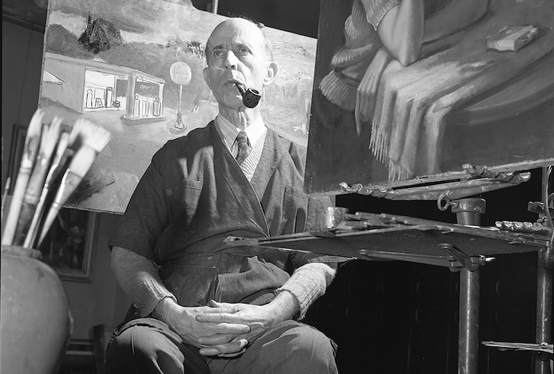Alfred Holbrook, shown here with his smock and pipe, founded the Georgia Museum of Art after a career as a New York City attorney.
