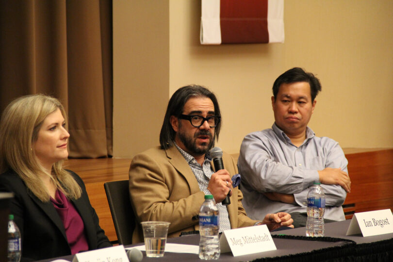 Ian Bogost, center, of Washington University in St. Louis speaks during a panel discussion at the AI and Data Science Across Disciplines Symposium on Nov. 30 at the University of Georgia Center for Continuing Education & Hotel. Meg Mittelstadt, left, director of UGA’s Center for Teaching and Learning, and Tianming Liu, right, Distinguished Research Professor in the School of Computing, and Youjin Kong (not pictured), assistant professor in the department of philosophy, joined Bogost in discussing advances in artificial intelligence. (Photo by Mike Wooten)