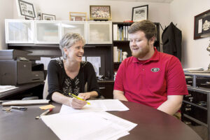 Senior lecturer and advisor Robyn Ovrick advising a student in an office on the Griffin Campus.