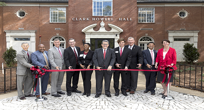 Administrators Ryan Nesbitt, left to right, Victor Wilson, Kelly Kerner, Career Center Director Scott Williams, student Layette Leflore, President Jere Morehead, student Christopher MacDonald, Bill Powell, Rahul Shrivastav, and Karri Hobson-Pape pose for the Ribbon Cutting during the Dedication Ceremony and Open House for the renovation of Clark Howell Hall on Monday.