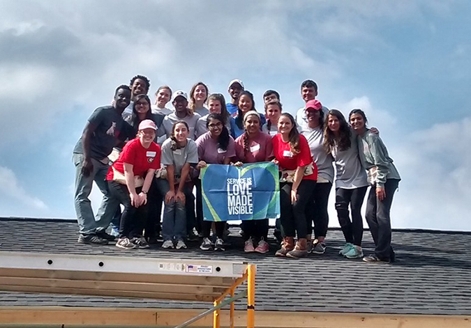 IMPACT Service students on a roof