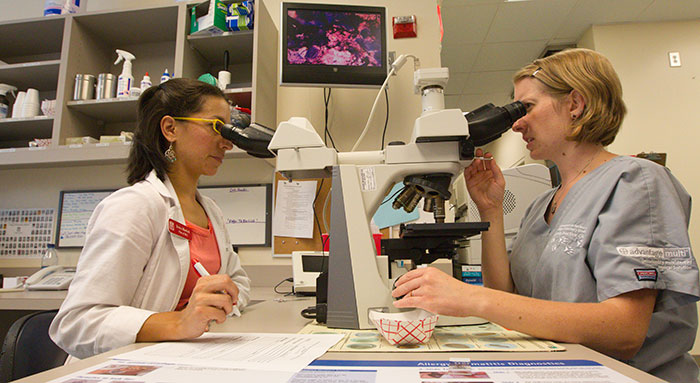 UGA Researchers viewing microscopes