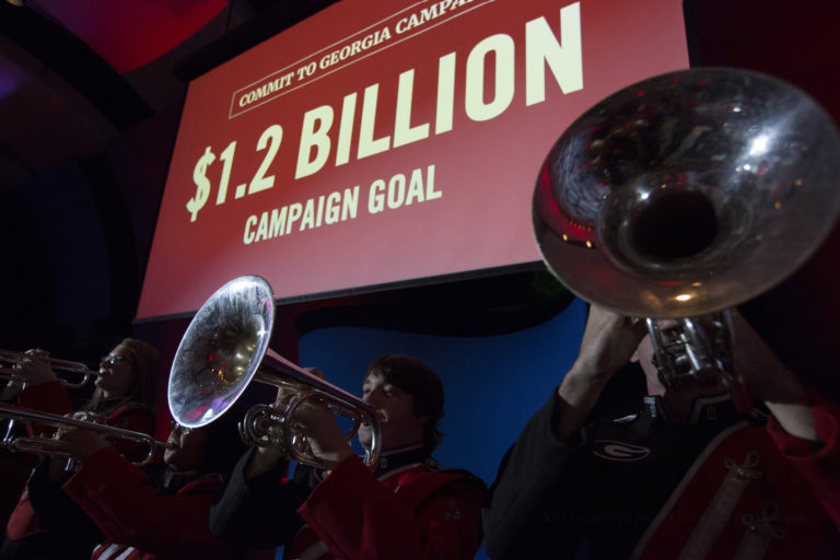 Members of the Redcoat Marching Band perform on stage during the Capital Campaign Kickoff Event at the Georgia Aquarium in Atlanta, Georgia.