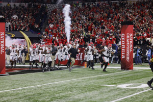 Football team running onto the field