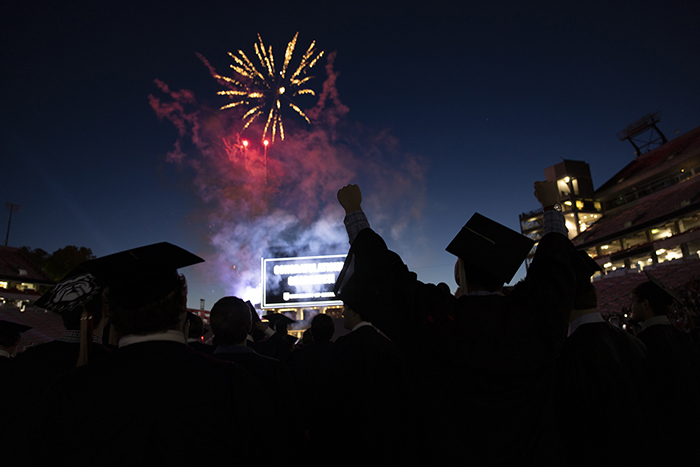 Graduates watch fireworks at the first of three spring undergraduate commencements at Sanford Stadium.