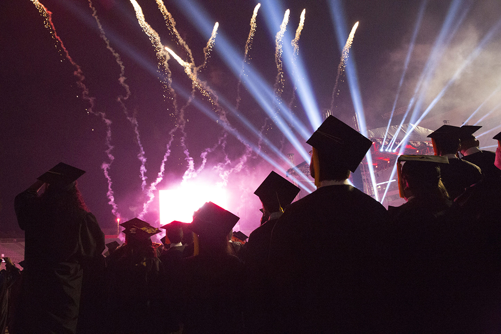 Students watching fireworks during ceremony