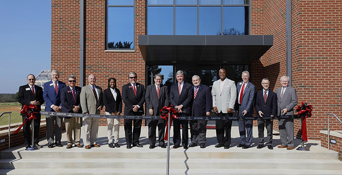 Local officials, regents, and President Jere Morehead pose for a photo at the ribbon cutting of the new Turfgrass Research and Education after the dedication ceremony on the Georgia campus in Griffin, Ga.